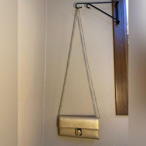 Over the shoulder clutch gold purse w/ chain strap and fold over lock closure